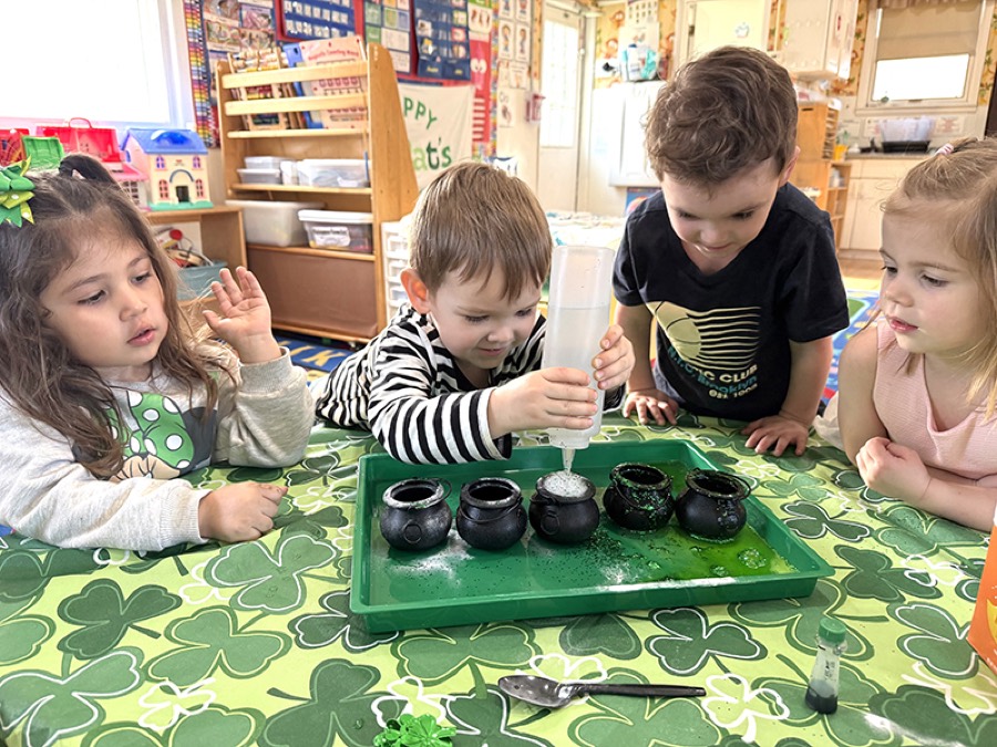 Preschoolers doing a hands-on St. Patrick's Day science activity